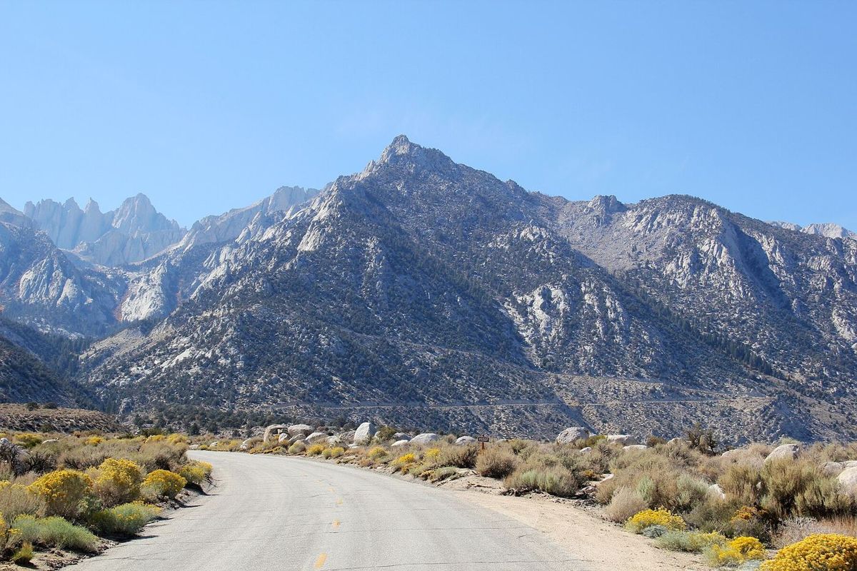 Whitney Portal Road climbing through the Alabama Hills toward the Sierra crest