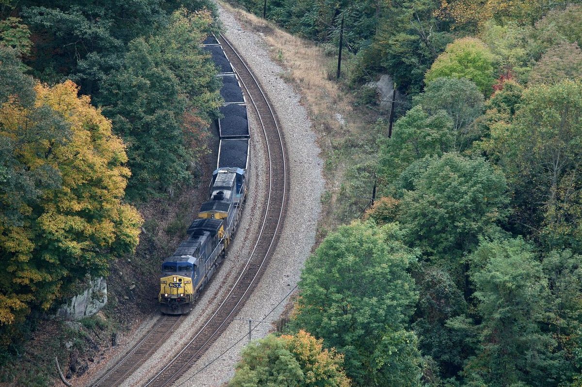 A coal train winding through a wooded hollow in southern West Virginia